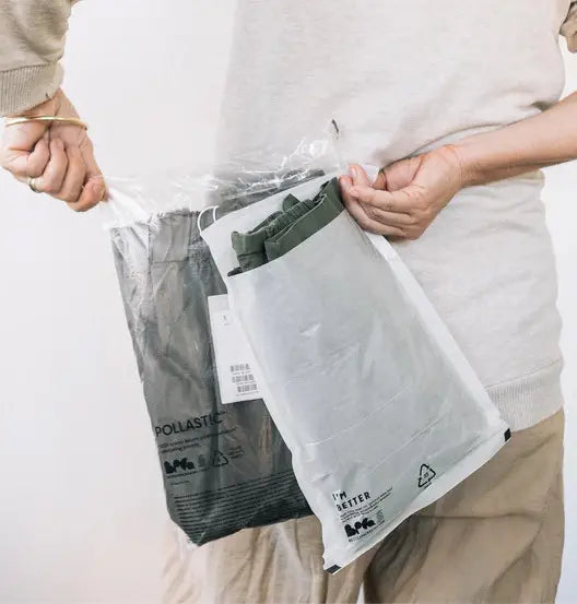 A person holding packages behind their pack