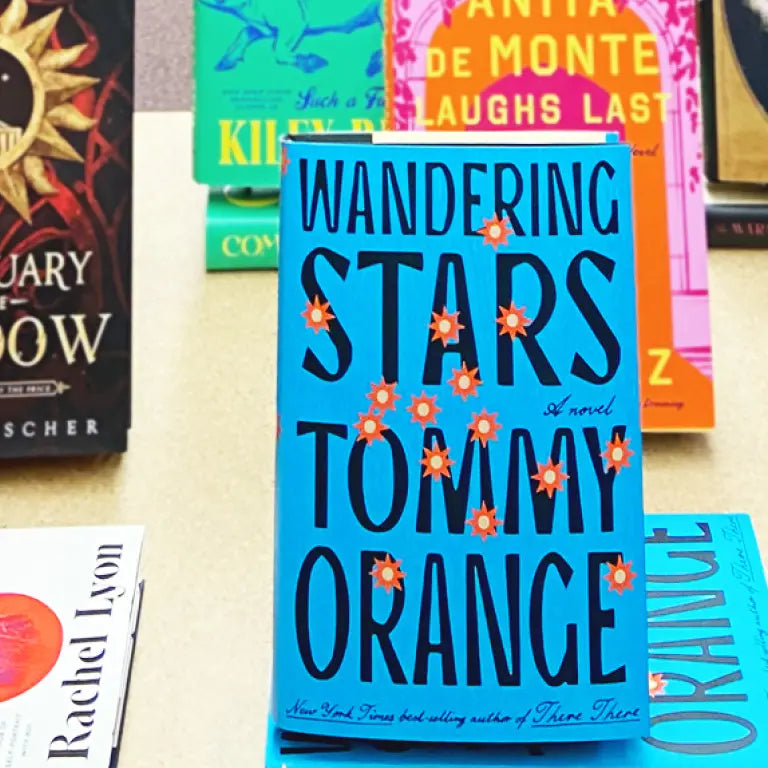 A brightly lit tabletop display of new reads at Federal Street Books.