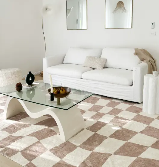 Neutral coloured living room with a checkered Miss Amara rug.