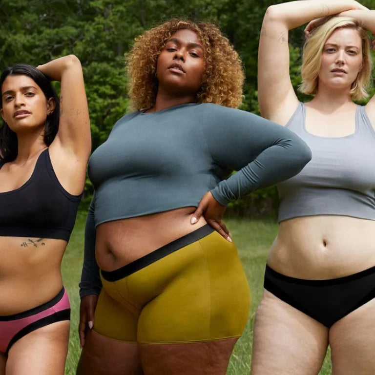 Three models wearing Thinx cotton underwear and tops