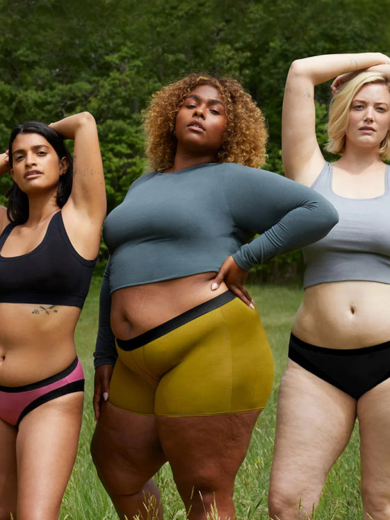 Three models wearing Thinx cotton underwear and tops